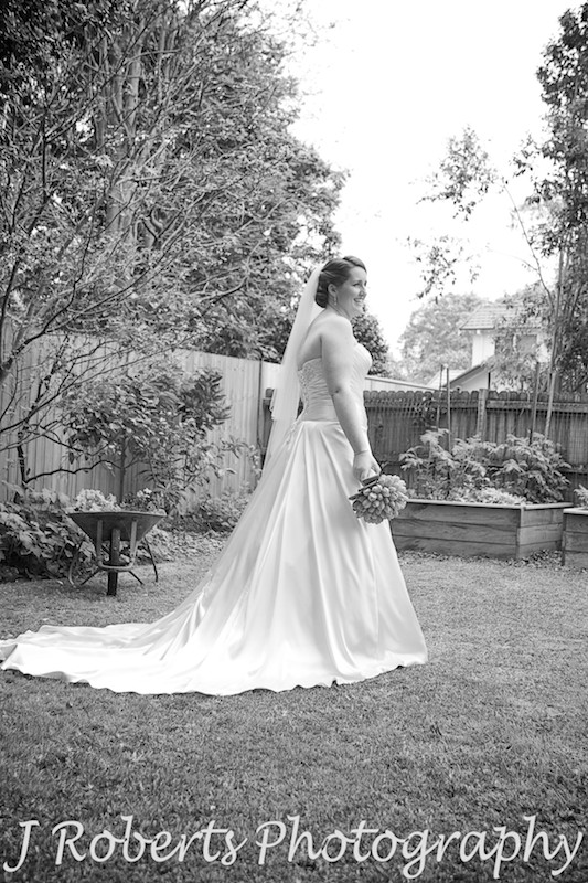 B&W of bride standing in garden - wedding photography sydney